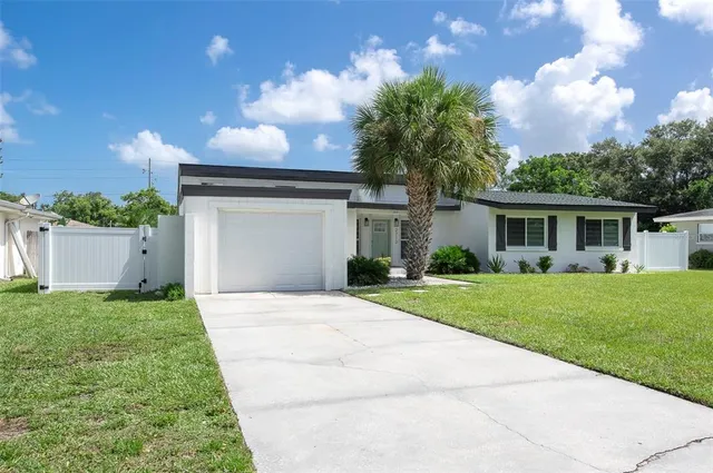 a front view of a house with a porch and livingroom