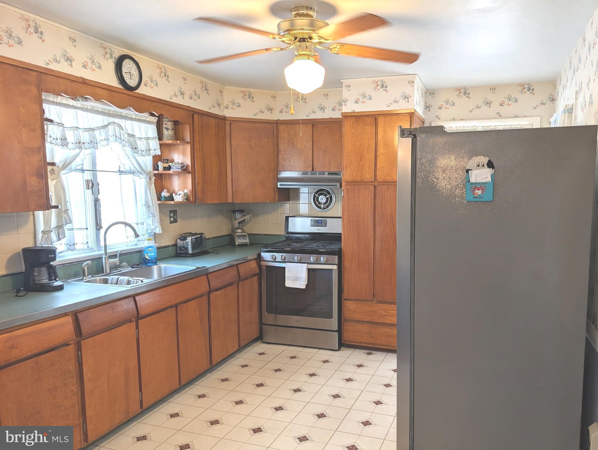85 Savo Avenue Lancaster, PA 17601 - Photo 9 of 19 a kitchen with granite countertop a refrigerator a sink and dishwasher