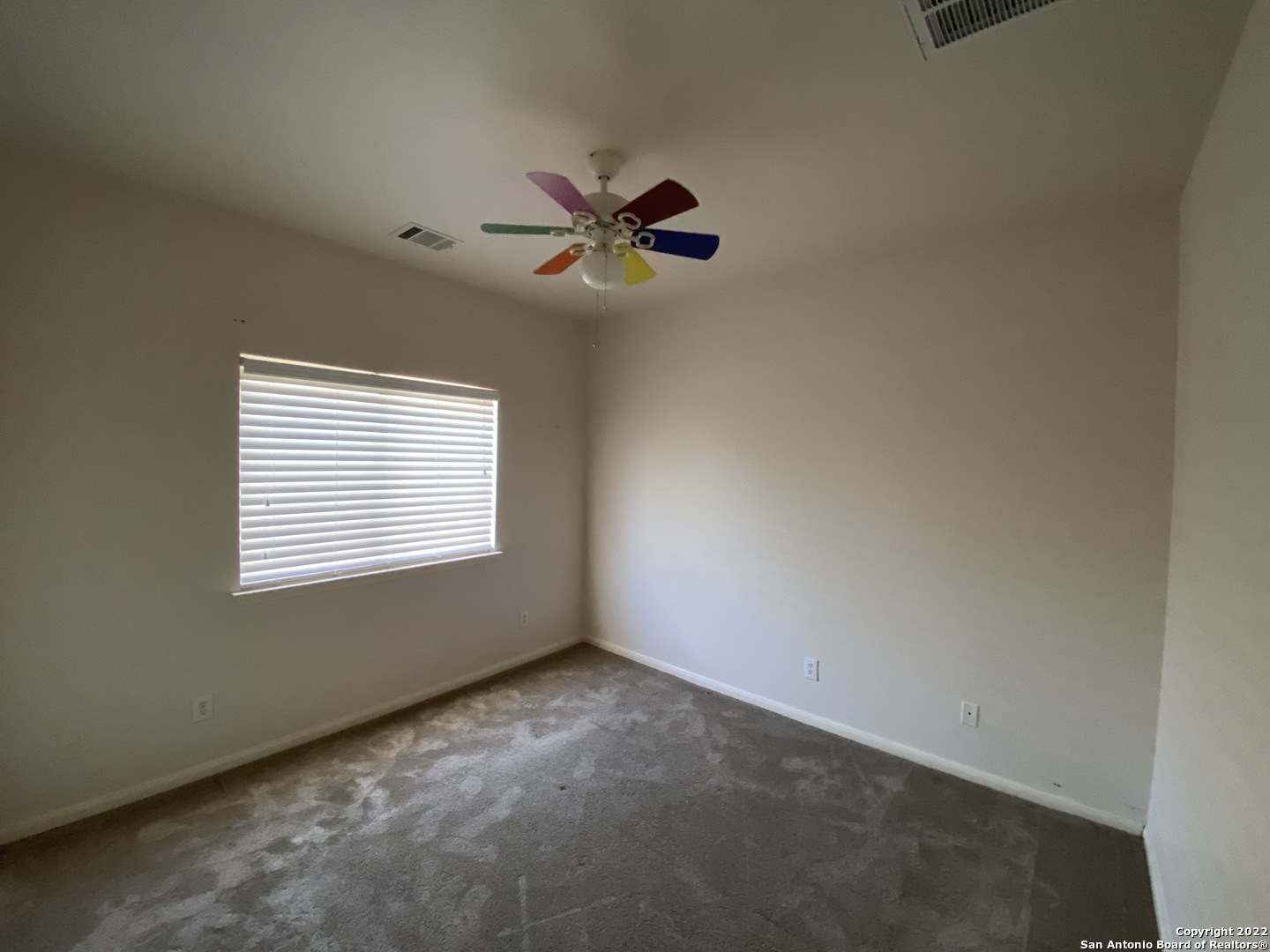 15518 Portales Pass Helotes, TX 78023 - Photo 19 of 25 a view of an empty room with a window