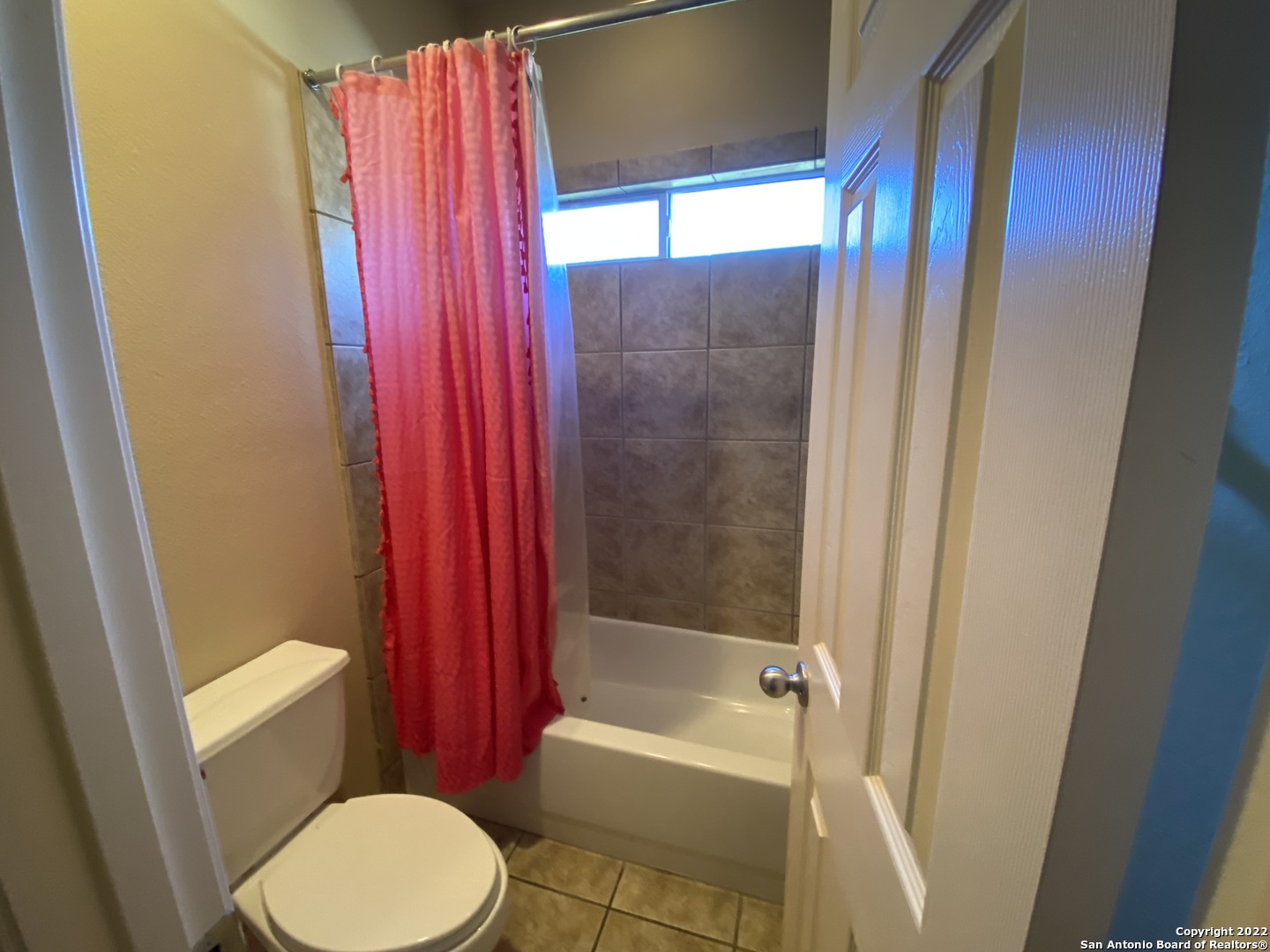 15518 Portales Pass Helotes, TX 78023 - Photo 20 of 25 a bathroom with a toilet and a bathtub
