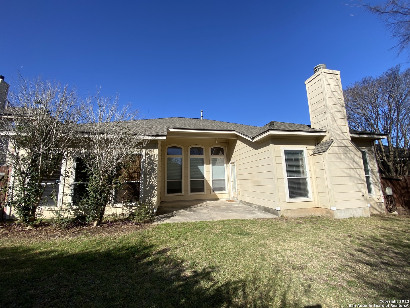 15518 Portales Pass Helotes, TX 78023 - Photo 23 of 25 a view of a house with a backyard