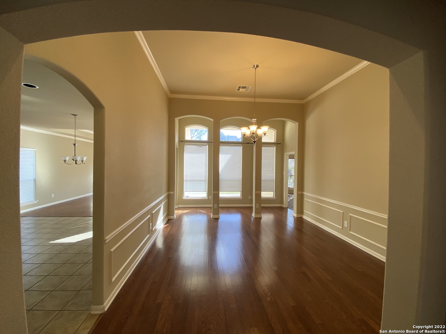 15518 Portales Pass Helotes, TX 78023 - Photo 3 of 25 a view of a room with wooden floor and a window