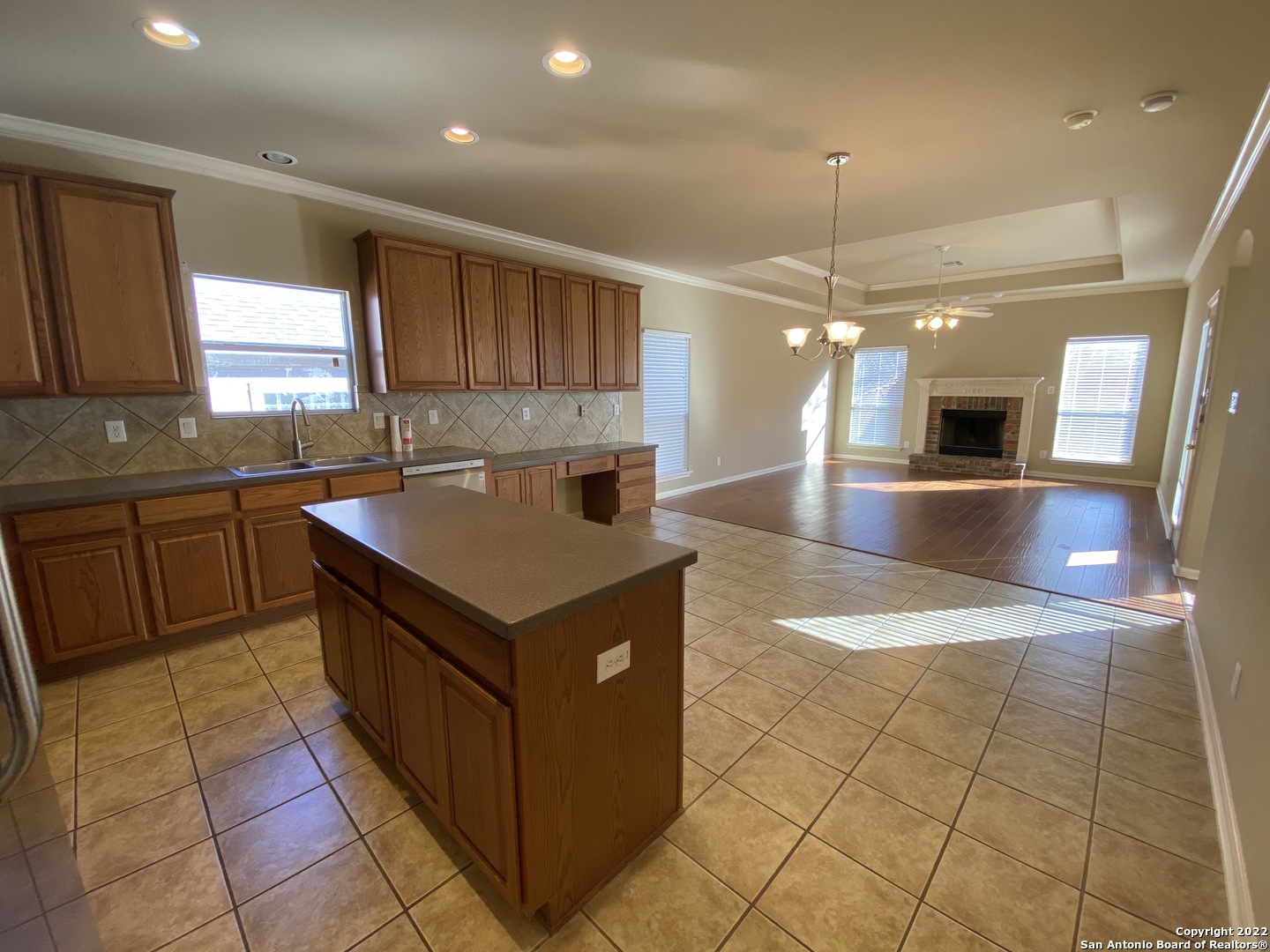 15518 Portales Pass Helotes, TX 78023 - Photo 10 of 25 a kitchen with stainless steel appliances granite countertop a sink counter top space cabinets and a kitchen counter tops