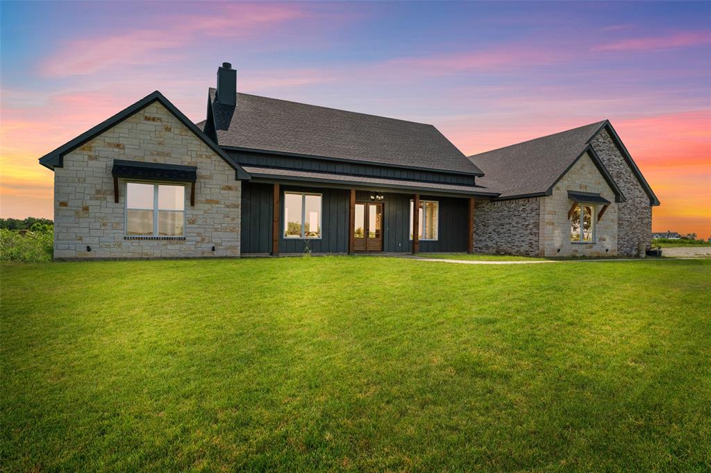 4411 Fm 751 Wills Point Wills Point, TX 75169 - Photo 6 of 40 Modern farmhouse exterior featuring stone and vertical panel siding