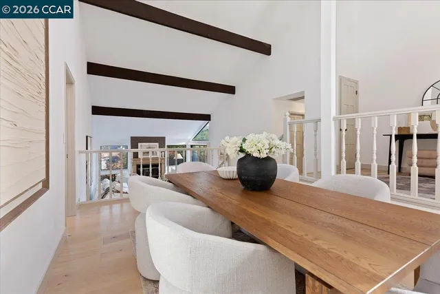 a living room with furniture flowerpot and wooden floor