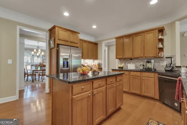 a living room with fireplace furniture and a flat screen tv