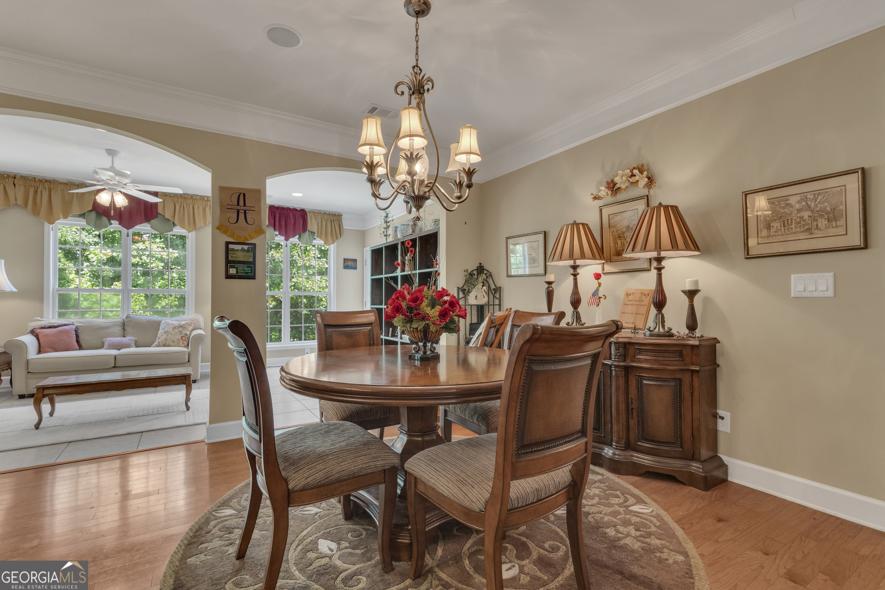 321 Anna Ruby Court Griffin, GA 30223 - Photo 19 of 81 a view of a dining room with furniture and a chandelier