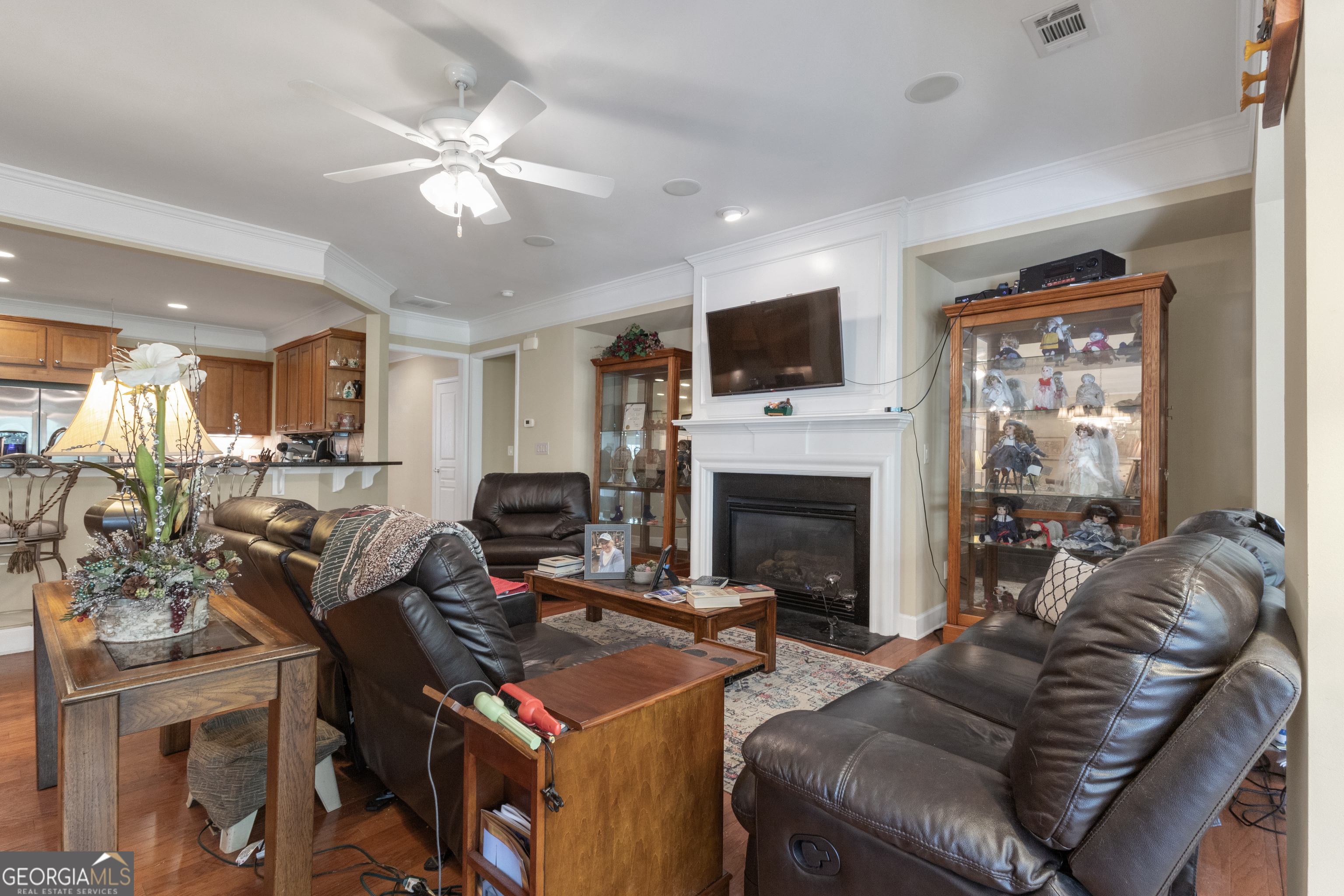 321 Anna Ruby Court Griffin, GA 30223 - Photo 25 of 81 a living room with furniture a fireplace and a flat screen tv