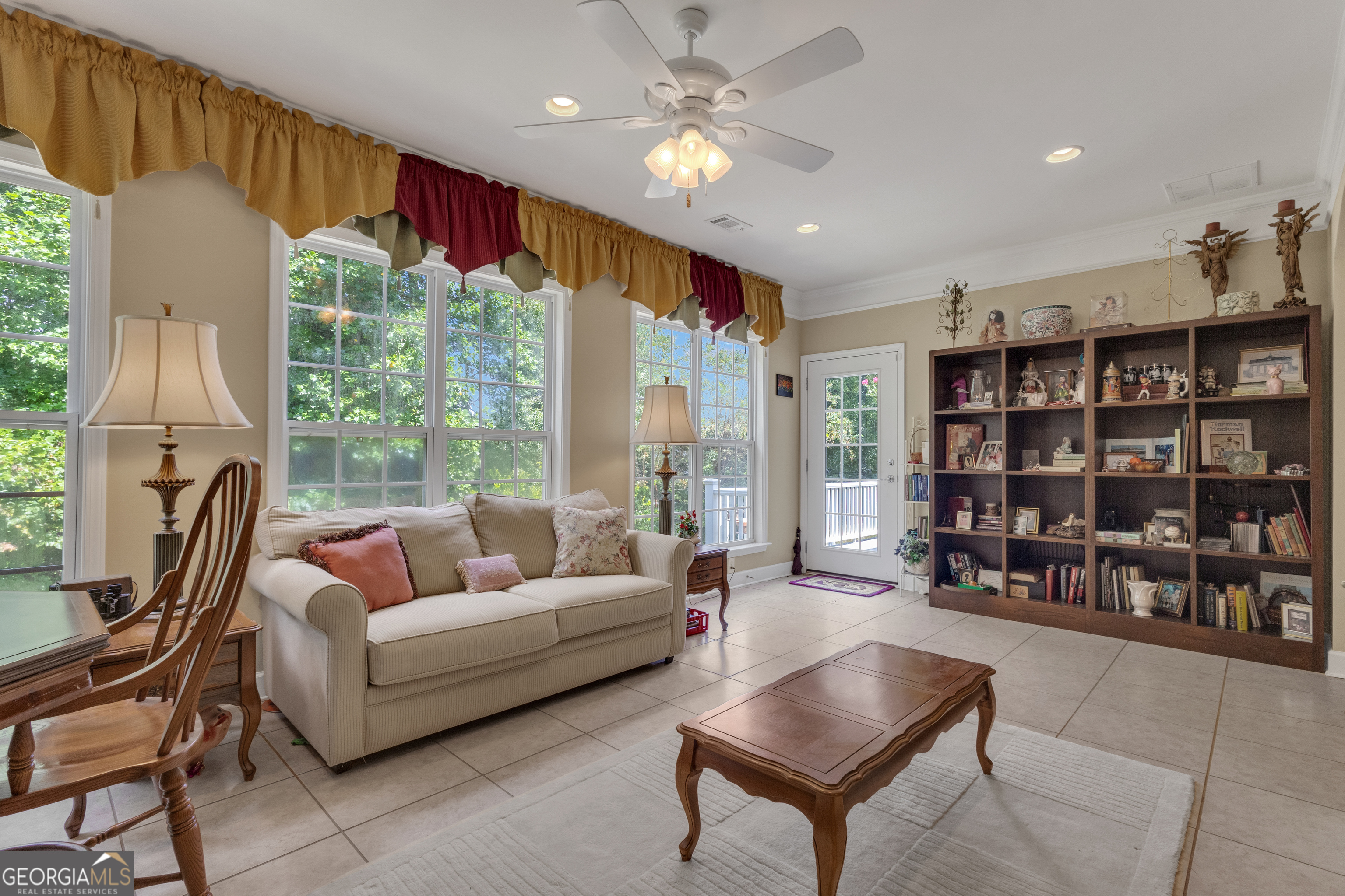 321 Anna Ruby Court Griffin, GA 30223 - Photo 29 of 81 a living room with furniture a large window and bookshelf