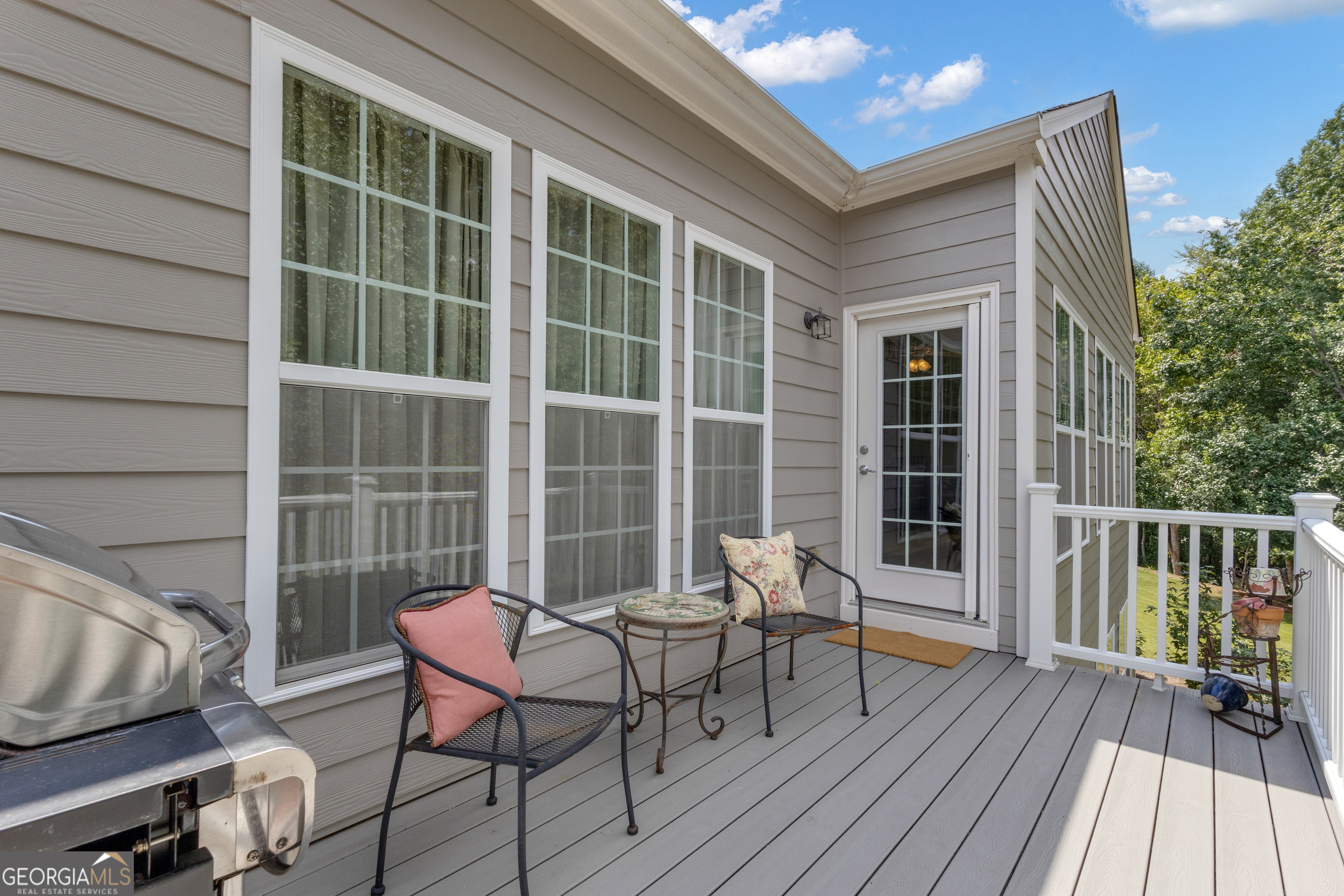 321 Anna Ruby Court Griffin, GA 30223 - Photo 31 of 81 a balcony with wooden floor and furniture