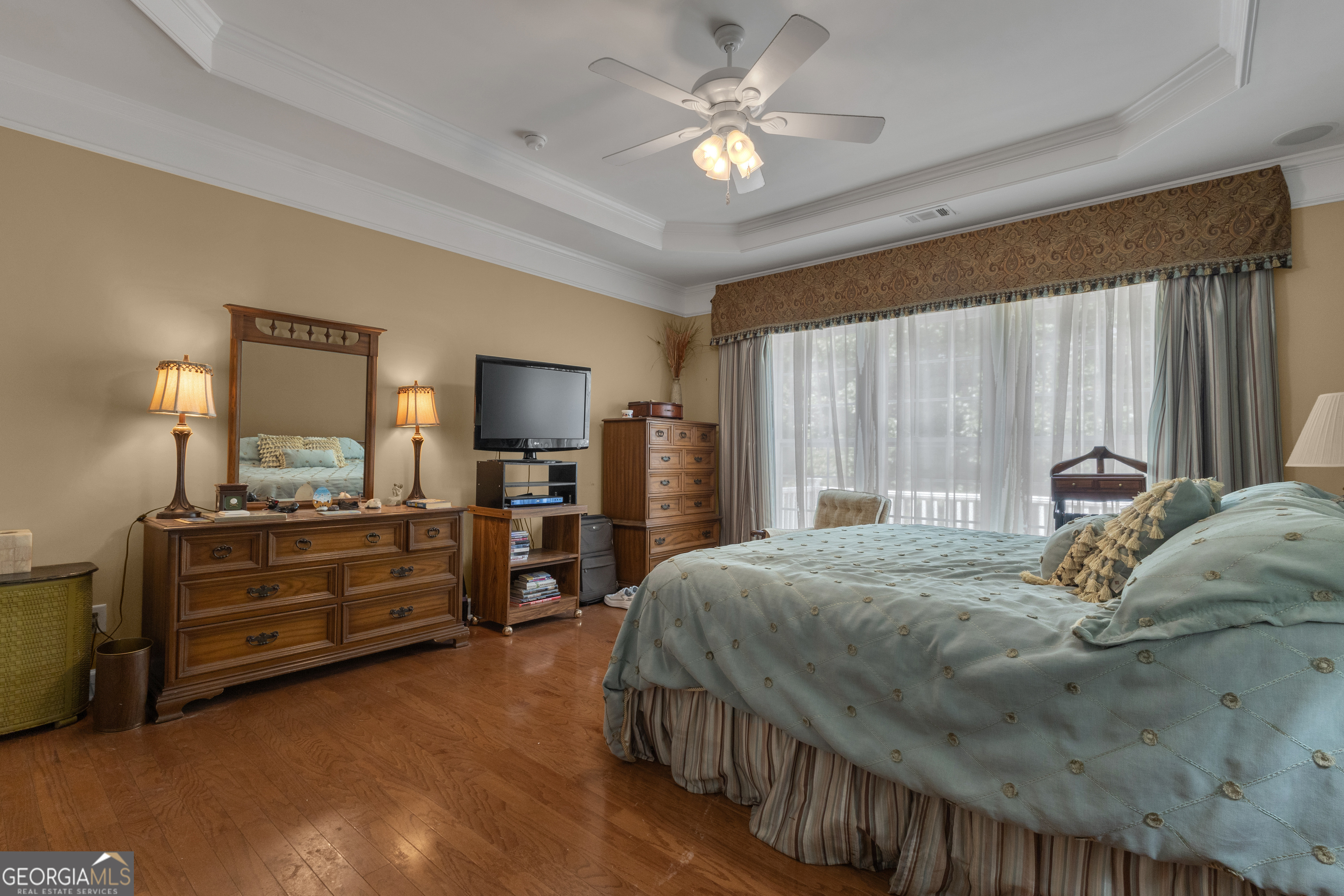 321 Anna Ruby Court Griffin, GA 30223 - Photo 34 of 81 a bedroom with a bed and a chandelier