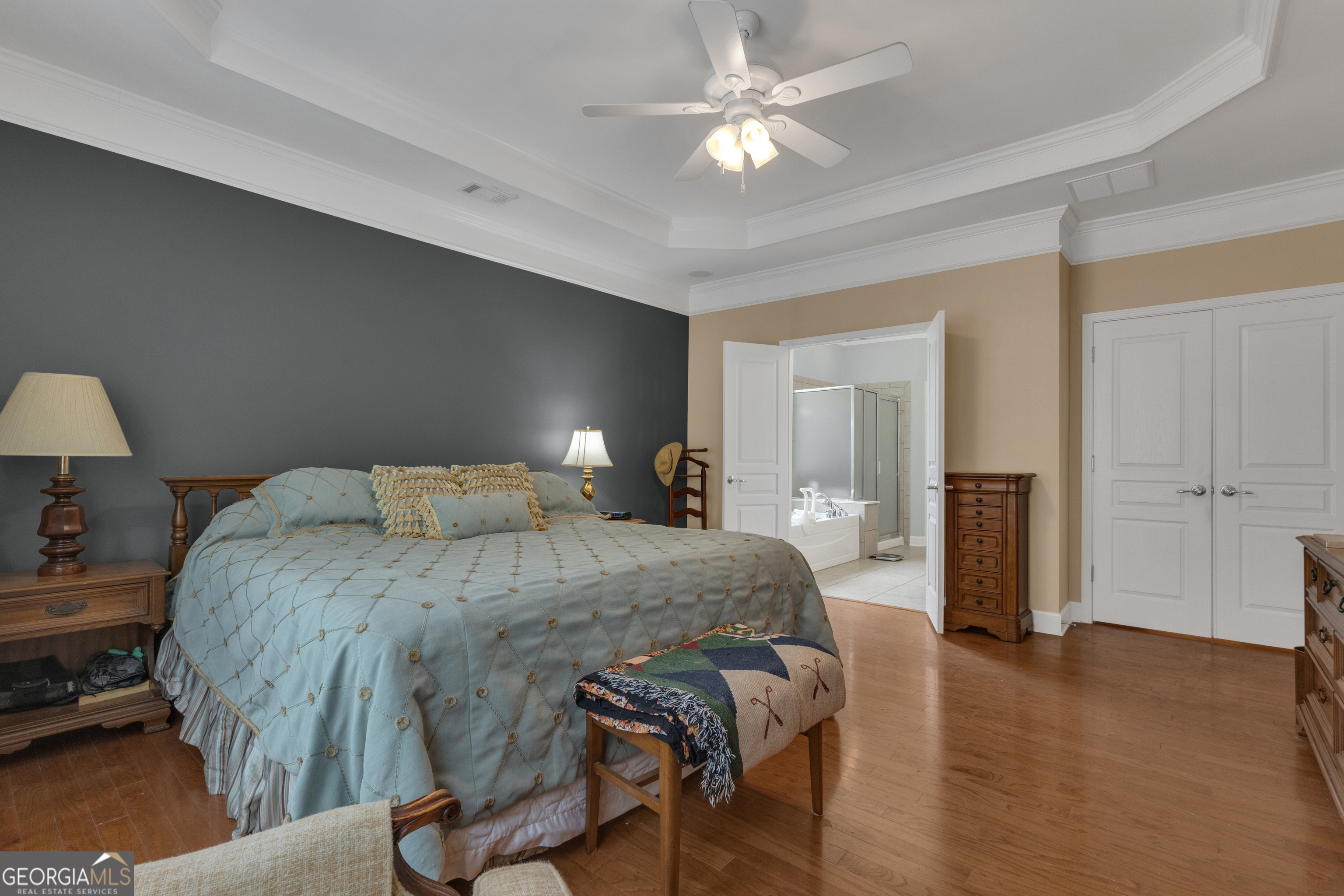 321 Anna Ruby Court Griffin, GA 30223 - Photo 35 of 81 a spacious bedroom with a bed and a chandelier