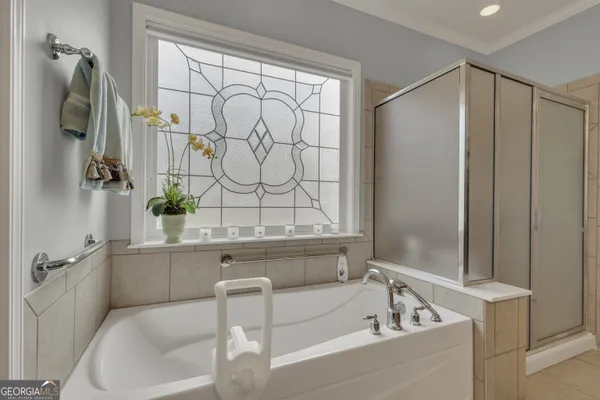 a view of a workspace with furniture and a ceiling fan