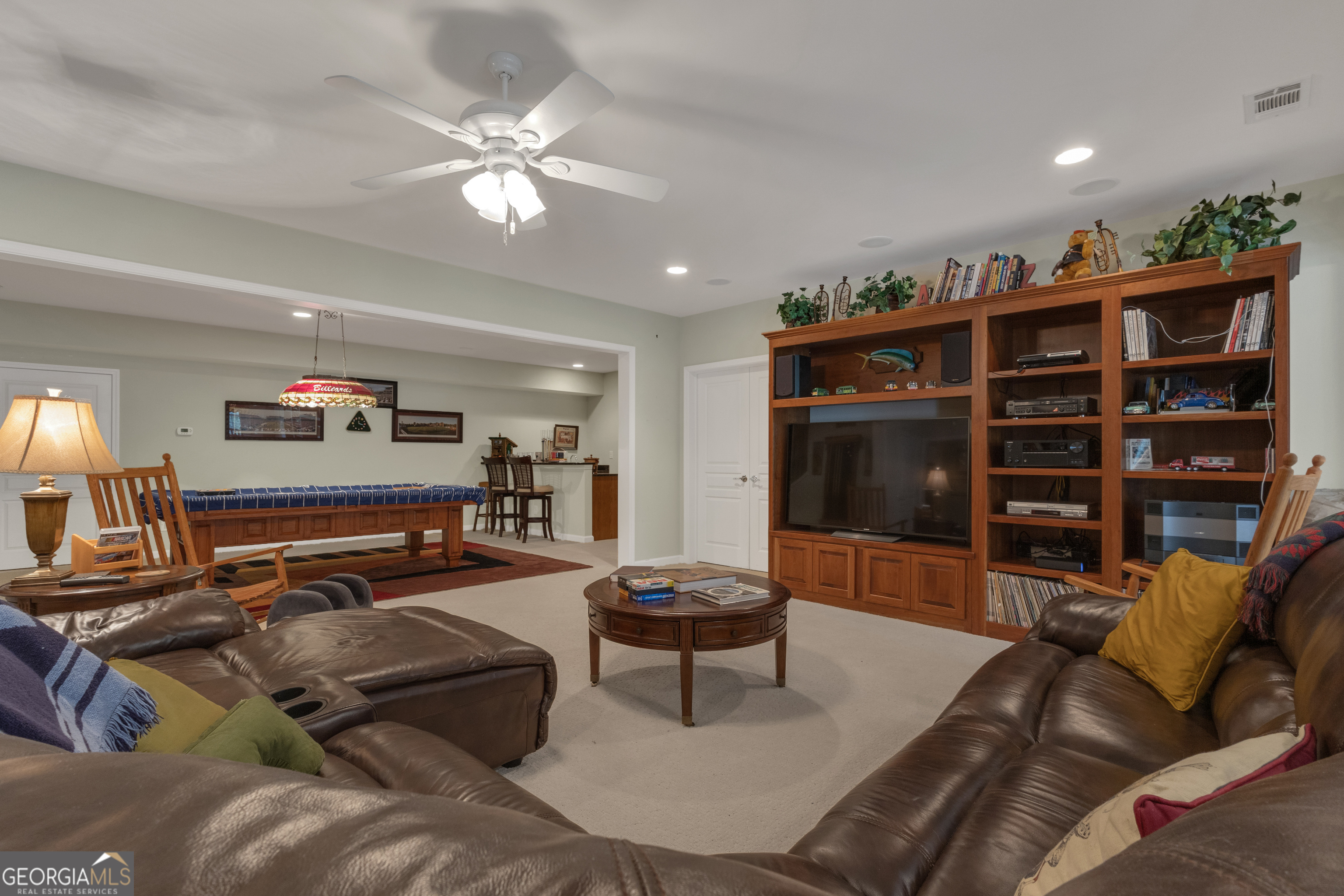 321 Anna Ruby Court Griffin, GA 30223 - Photo 52 of 81 a living room with furniture and a flat screen tv