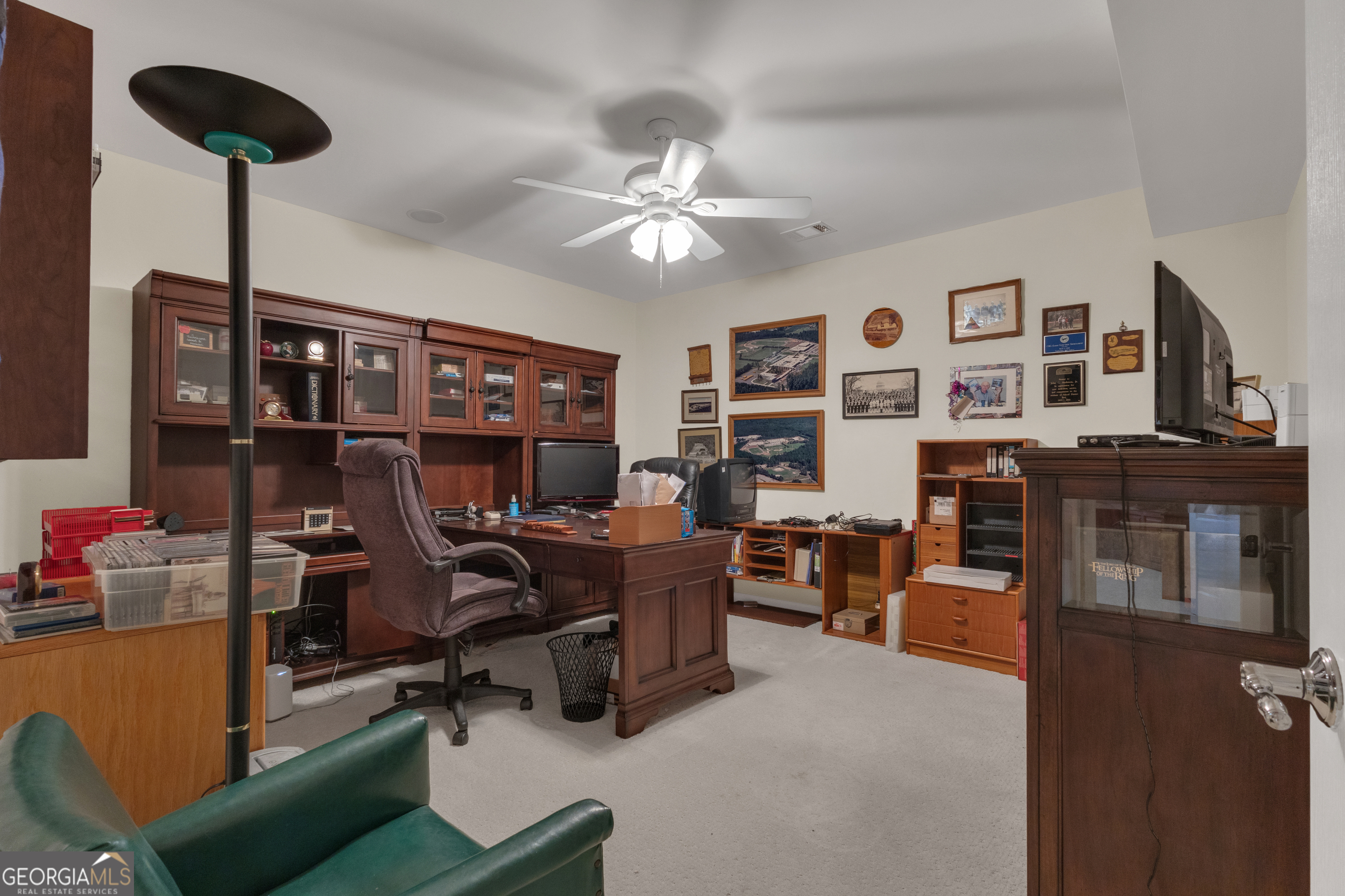 321 Anna Ruby Court Griffin, GA 30223 - Photo 55 of 81 a view of a workspace with furniture and a ceiling fan