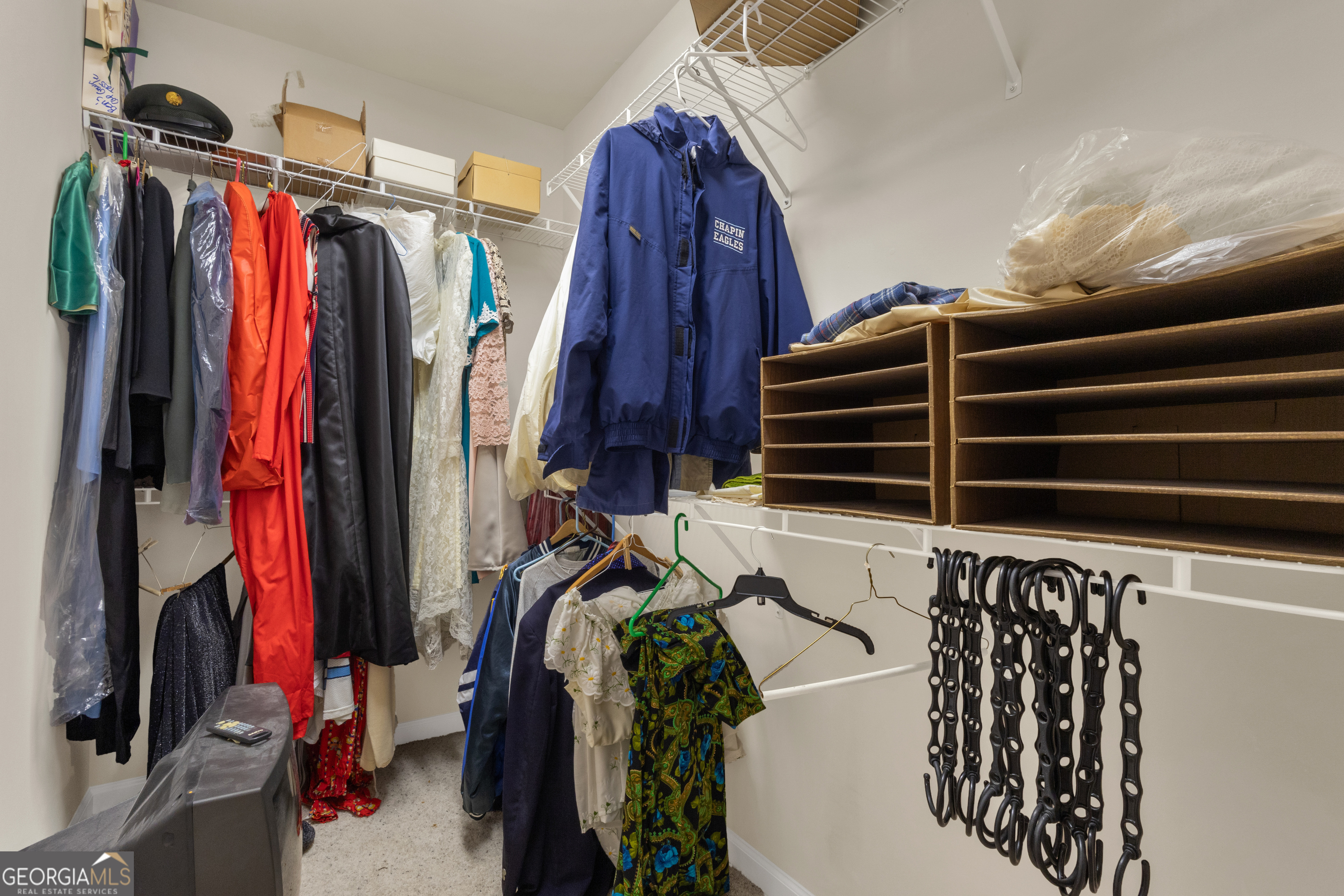 321 Anna Ruby Court Griffin, GA 30223 - Photo 63 of 81 a view of walk in closet with clothes and shoes