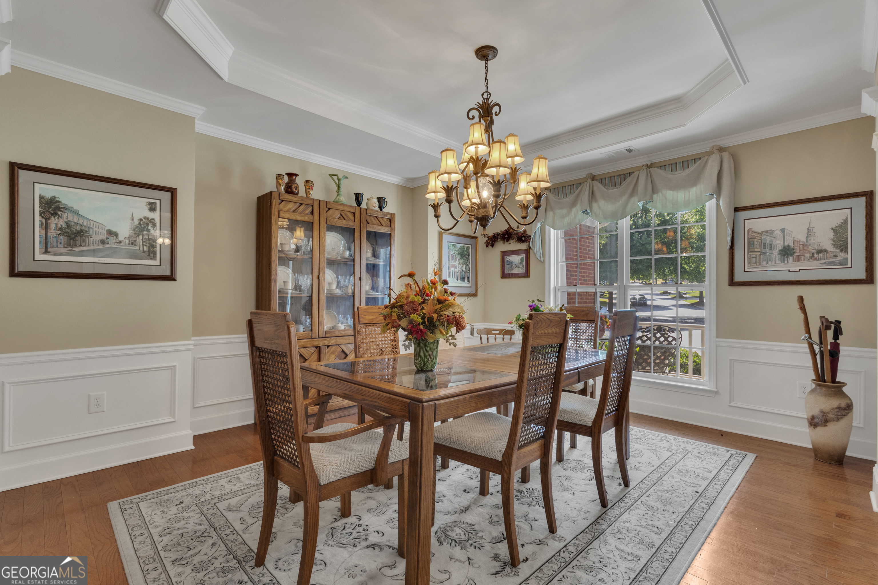 321 Anna Ruby Court Griffin, GA 30223 - Photo 7 of 81 a view of a dining room with furniture a chandelier and wooden floor