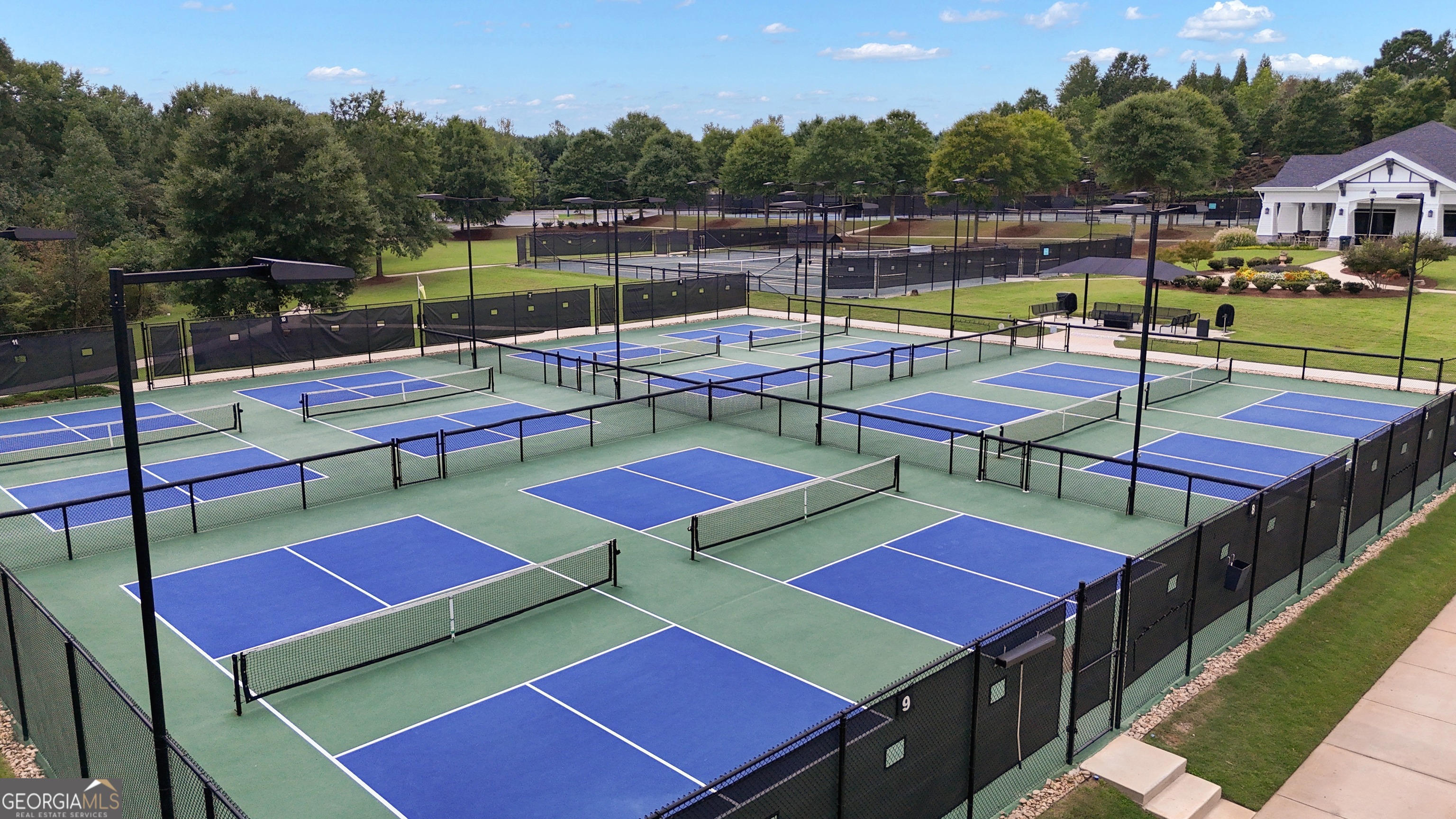 321 Anna Ruby Court Griffin, GA 30223 - Photo 78 of 81 a view of a tennis court with furniture and a lake view