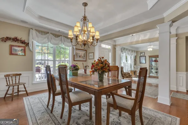 a kitchen with stainless steel appliances granite countertop sink stove refrigerator and cabinets