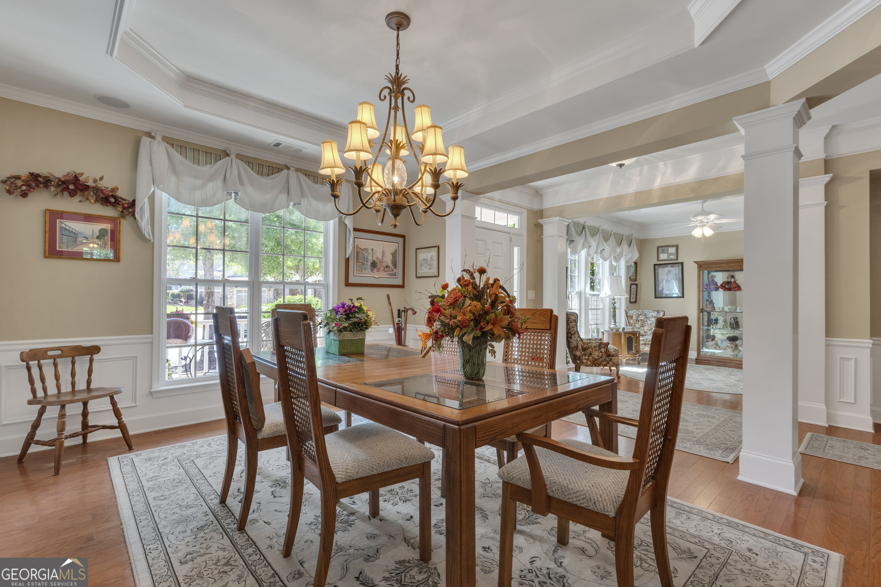 321 Anna Ruby Court Griffin, GA 30223 - Photo 8 of 81 a view of a dining room with furniture a chandelier and wooden floor