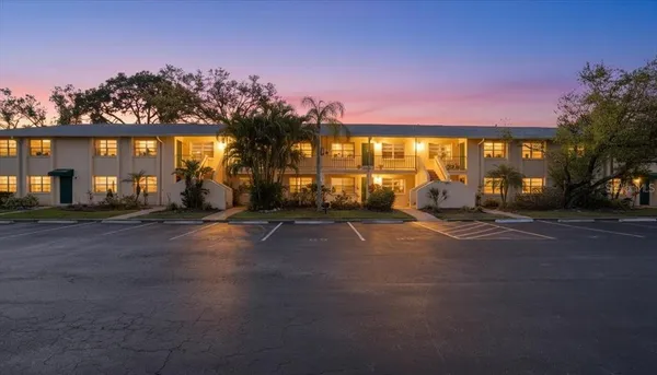 a view of a street with a building in the background