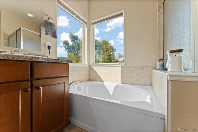 a bathroom with a bathtub and a sink