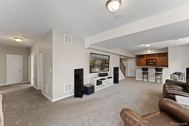 a kitchen that has a sink and a stove in it