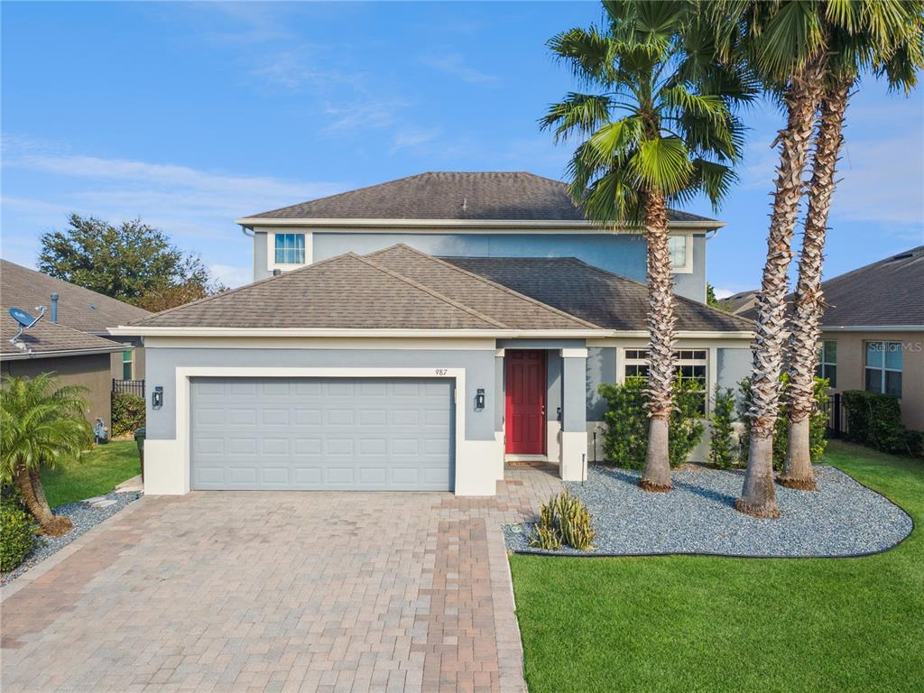 987 Nathan Ridge Road Clermont, FL 34715 - Photo 1 of 1 a front view of house with yard and green space