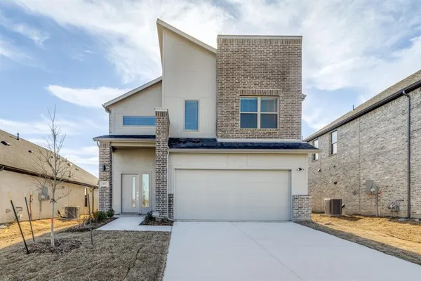 a front view of a house with a garage