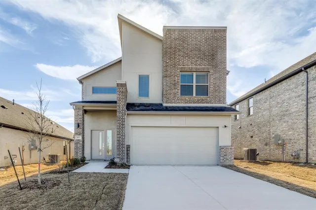 a front view of a house with a garage