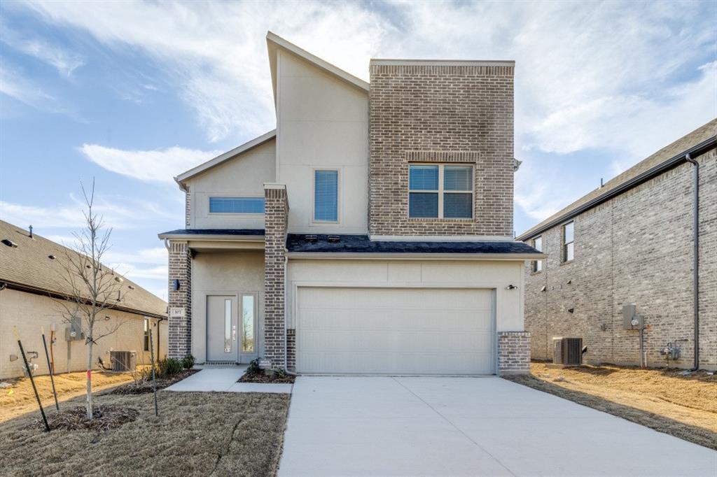 a front view of a house with a garage