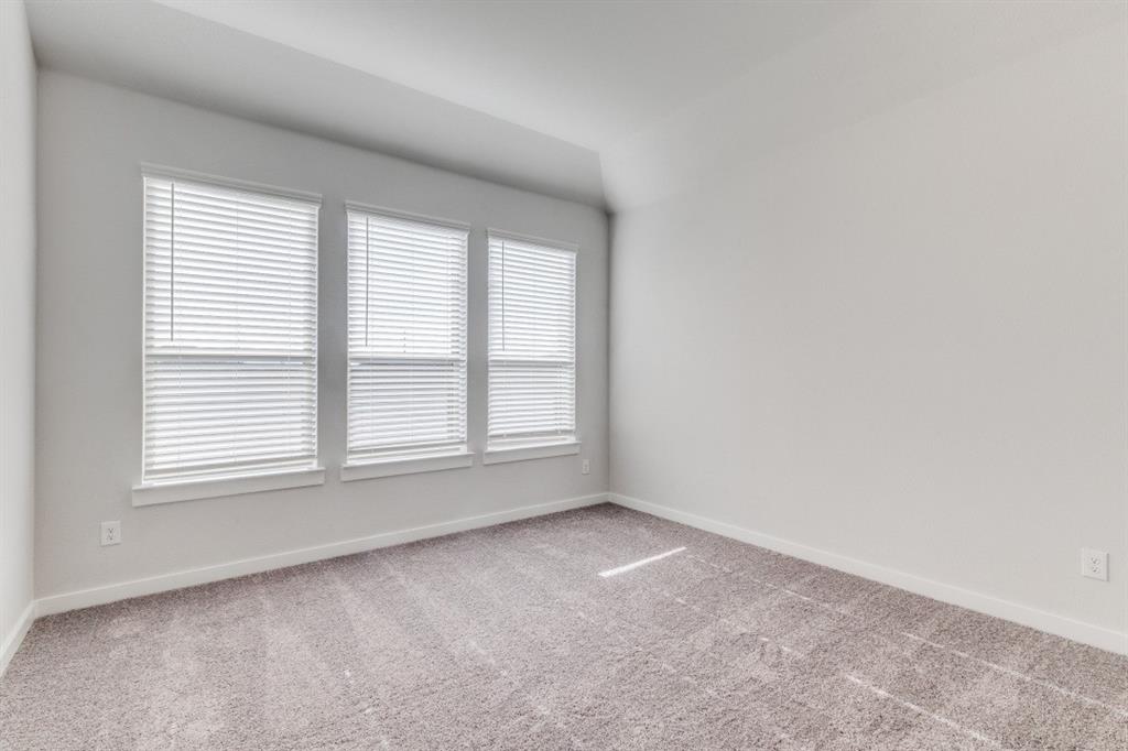 107 Huckleberry Road Forney, TX 75126 - Photo 12 of 30 an empty room with a window