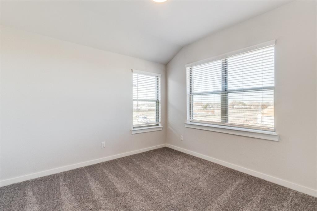 107 Huckleberry Road Forney, TX 75126 - Photo 16 of 30 an empty room with a window