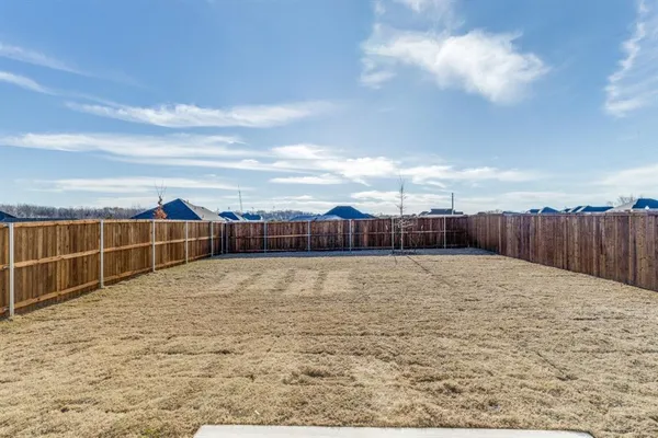 a house view with a backyard space