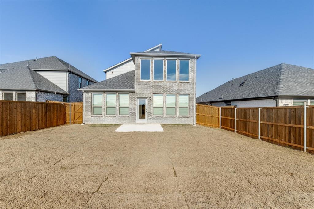 107 Huckleberry Road Forney, TX 75126 - Photo 25 of 30 a house view with a backyard space