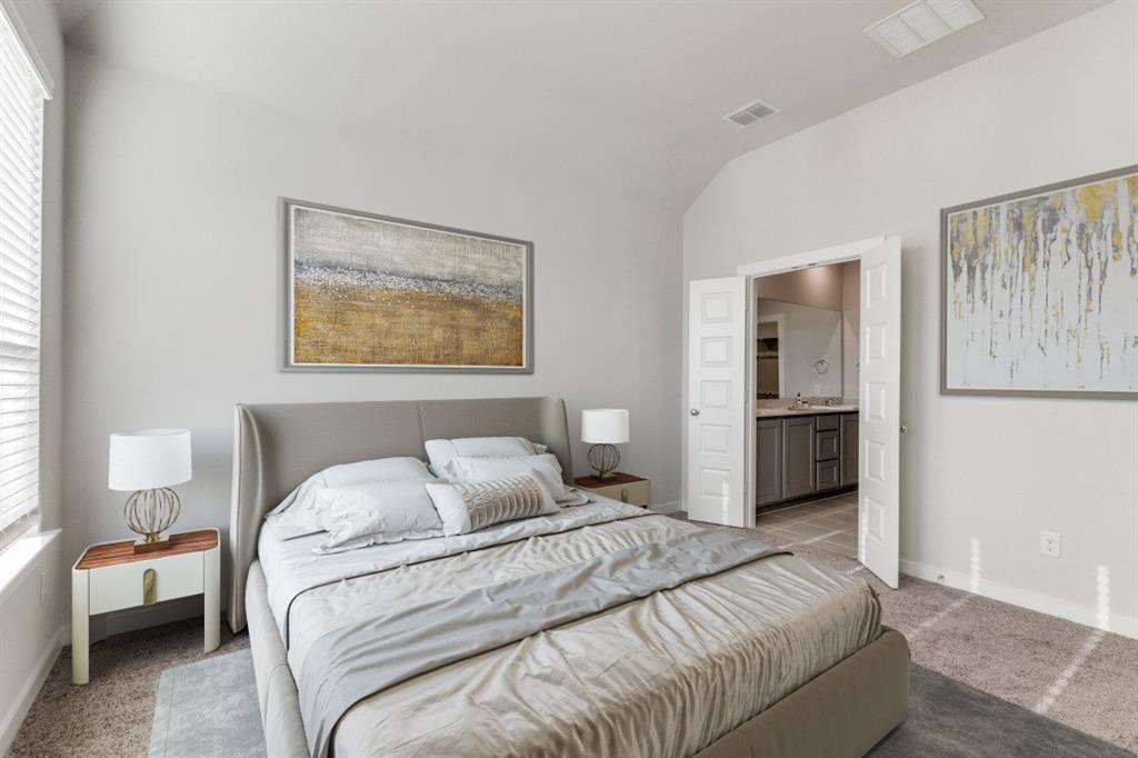 107 Huckleberry Road Forney, TX 75126 - Photo 27 of 30 a bedroom with a bed and a painting on the wall