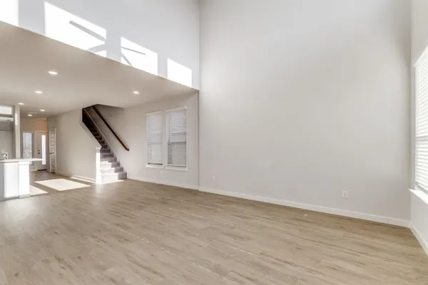 a view of an entryway with wooden floor