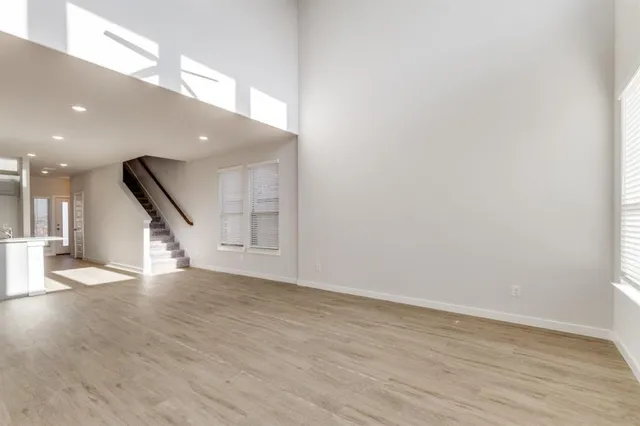 a view of an entryway with wooden floor
