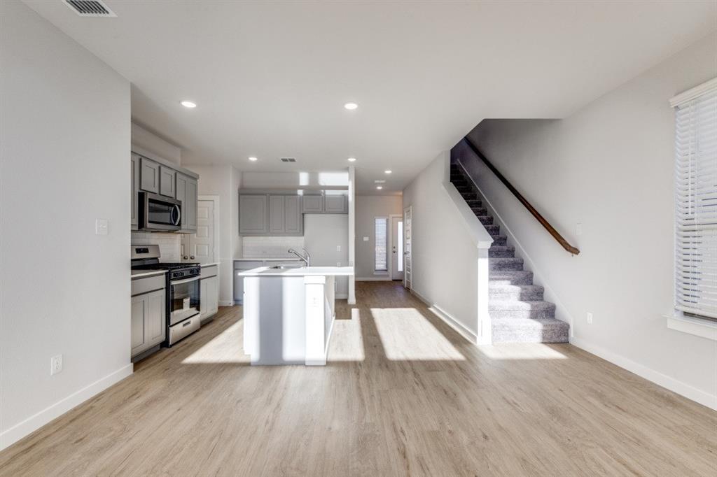 107 Huckleberry Road Forney, TX 75126 - Photo 6 of 30 a view of kitchen with furniture and wooden floor