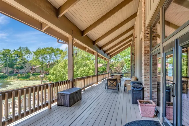 a view of a chairs and table in the balcony