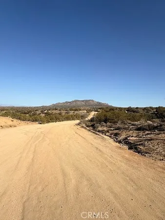 a view of ocean and mountain
