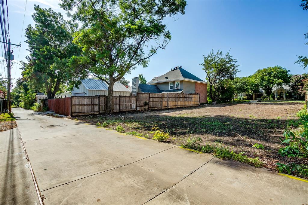 4120 Mattison Avenue Fort Worth, TX 76107 - Photo 19 of 20 a front view of a house with a yard and a garage