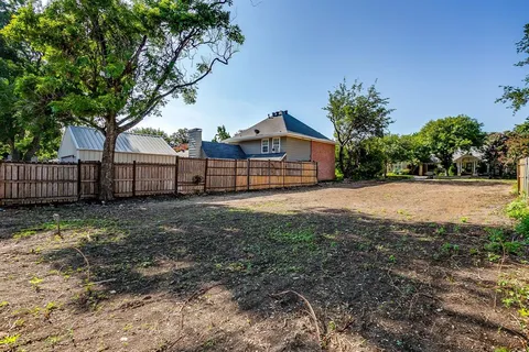 a view of backyard with green space