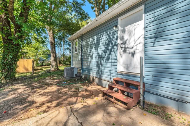 a backyard of a house with outdoor seating