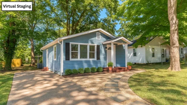 a front view of a house with a garden