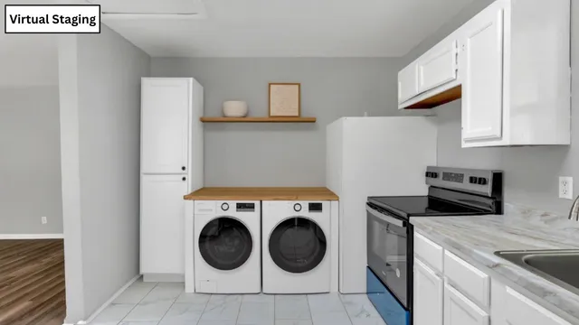 a utility room with sink dryer and washer