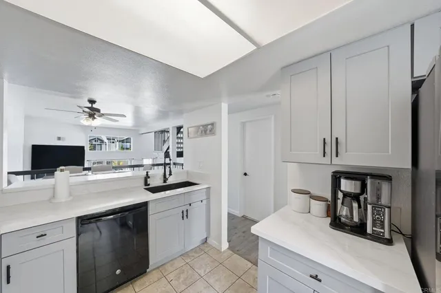 a room with a refrigerator and a window