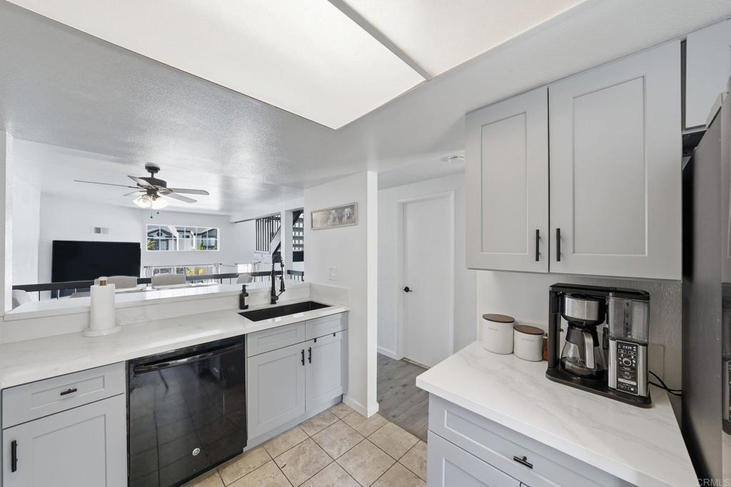 8765 Spring Canyon Drive Spring Valley, CA 91977 - Photo 14 of 37 a kitchen with a sink appliances and cabinets