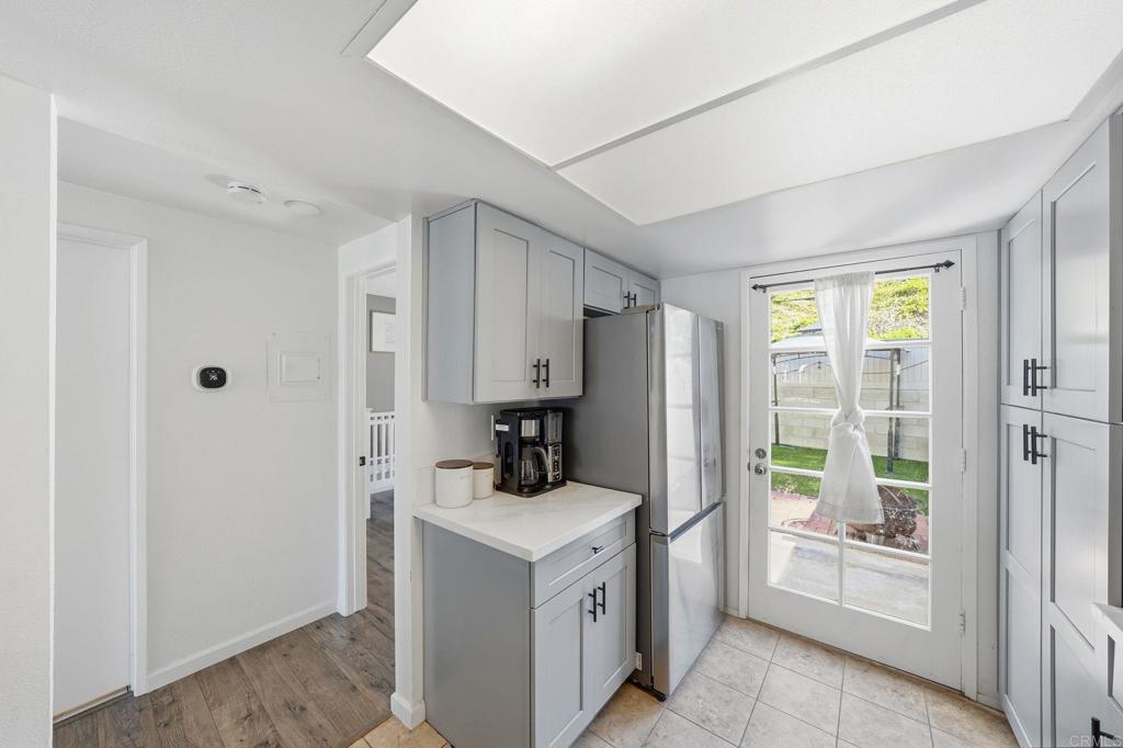 8765 Spring Canyon Drive Spring Valley, CA 91977 - Photo 15 of 37 a room with a refrigerator and a window
