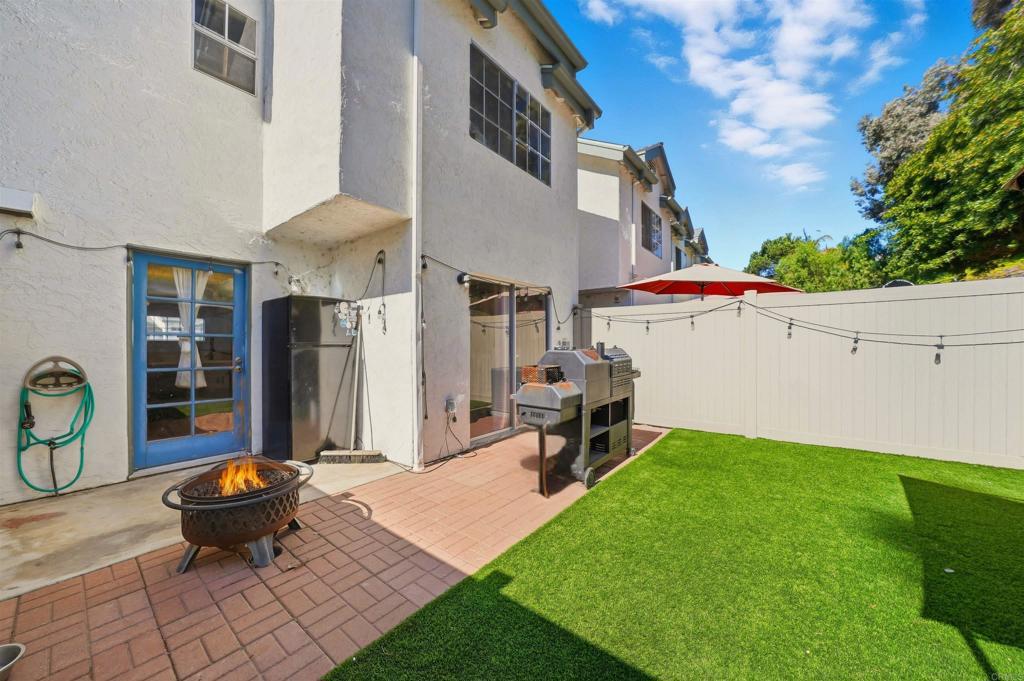 8765 Spring Canyon Drive Spring Valley, CA 91977 - Photo 20 of 37 a view of a backyard with table and chairs